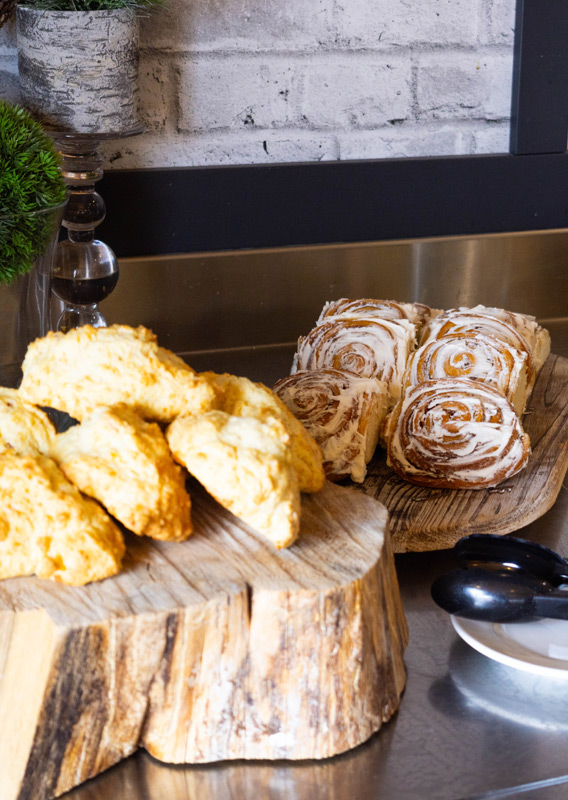 A Continental Breakfast with scones, cinnamon buns, and cereal
