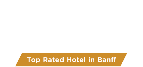 The Mount Royal Hotel rooftop hot tub in the summer, with a view of Cascade Mountain.
